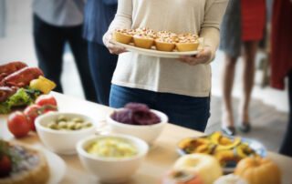 woman is holding dish pastry